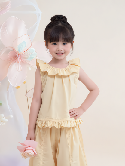 Young girl in a yellow outfit with balloons in the background